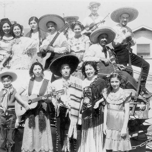 Oceanside Historical Society - 1930-006 Cinco De Mayo celebration, Bush Street, Joaquin Vasquez, center, standing circa 1937