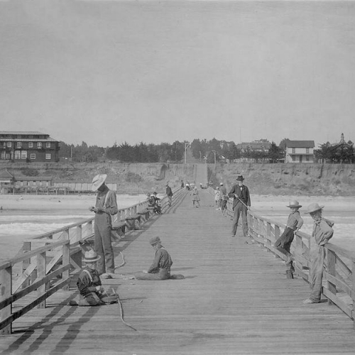 Oceanside Historical Society - Oceanside Pier, 1904, Beniah James holding pole,right, Ralph and Warren James, 2 boys on right, Edward James photo 1904_resize